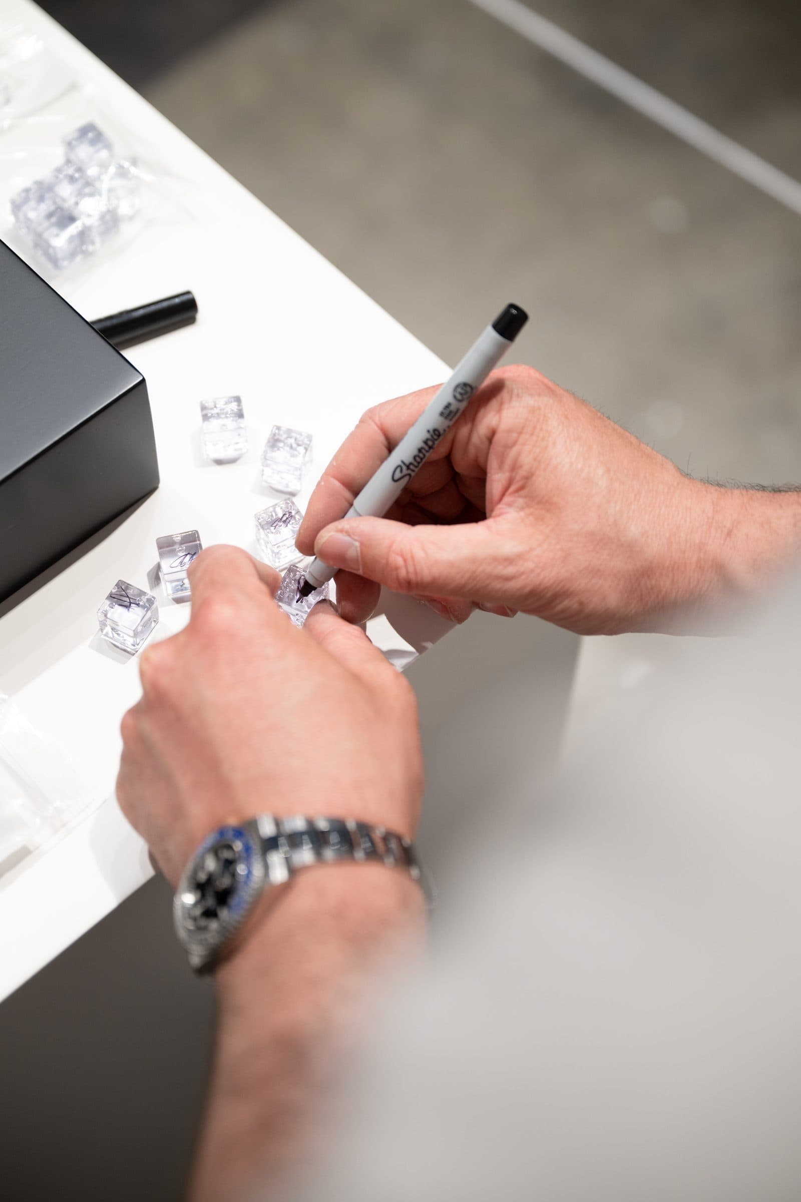 Jack Butcher signing dice