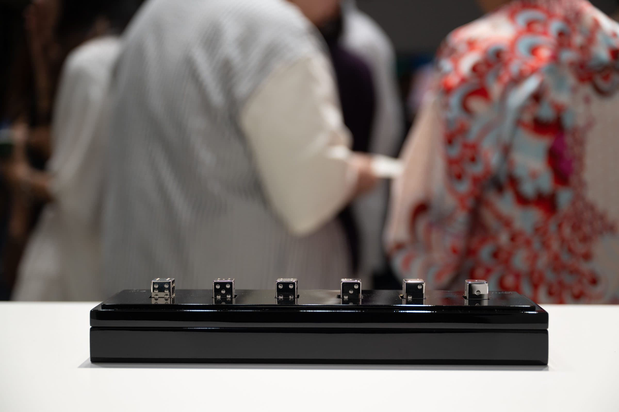 Visitors passing the silver set